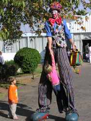 Kenbo the clown busking on stilts