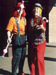 Gerard and Pinky the clowns juggling with clubs